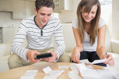 Young couple reviewing bills
