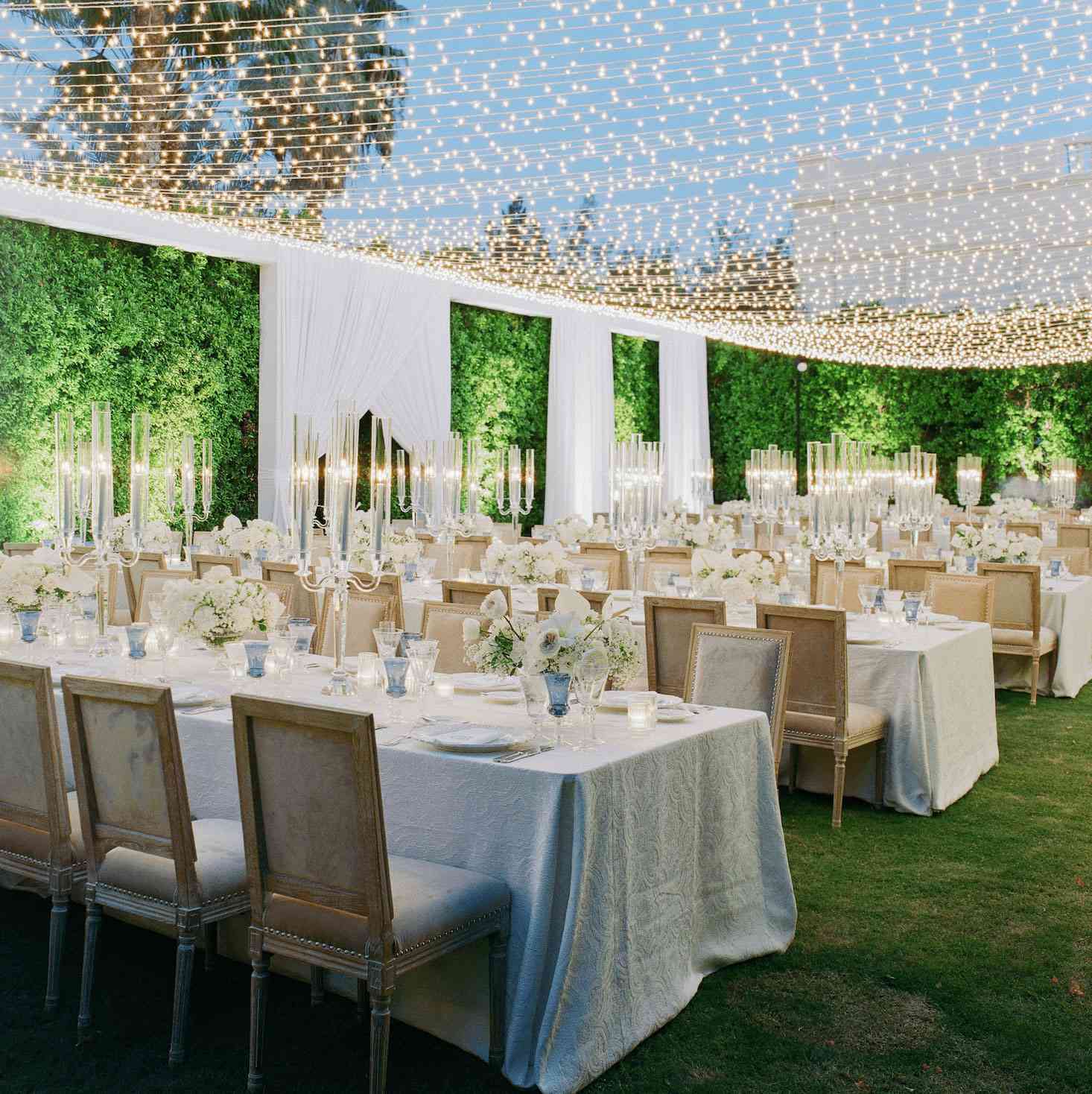 Dining tables and chairs set up for a wedding reception 