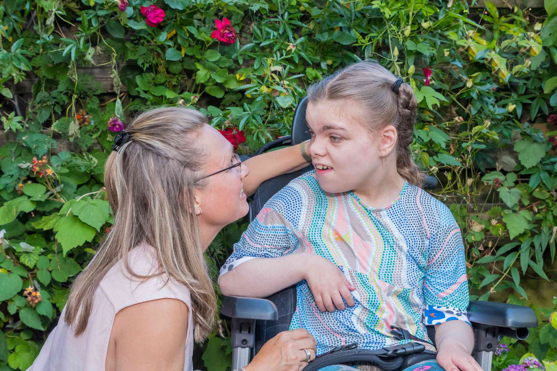 caregiver girl intellectual disability wheelchair