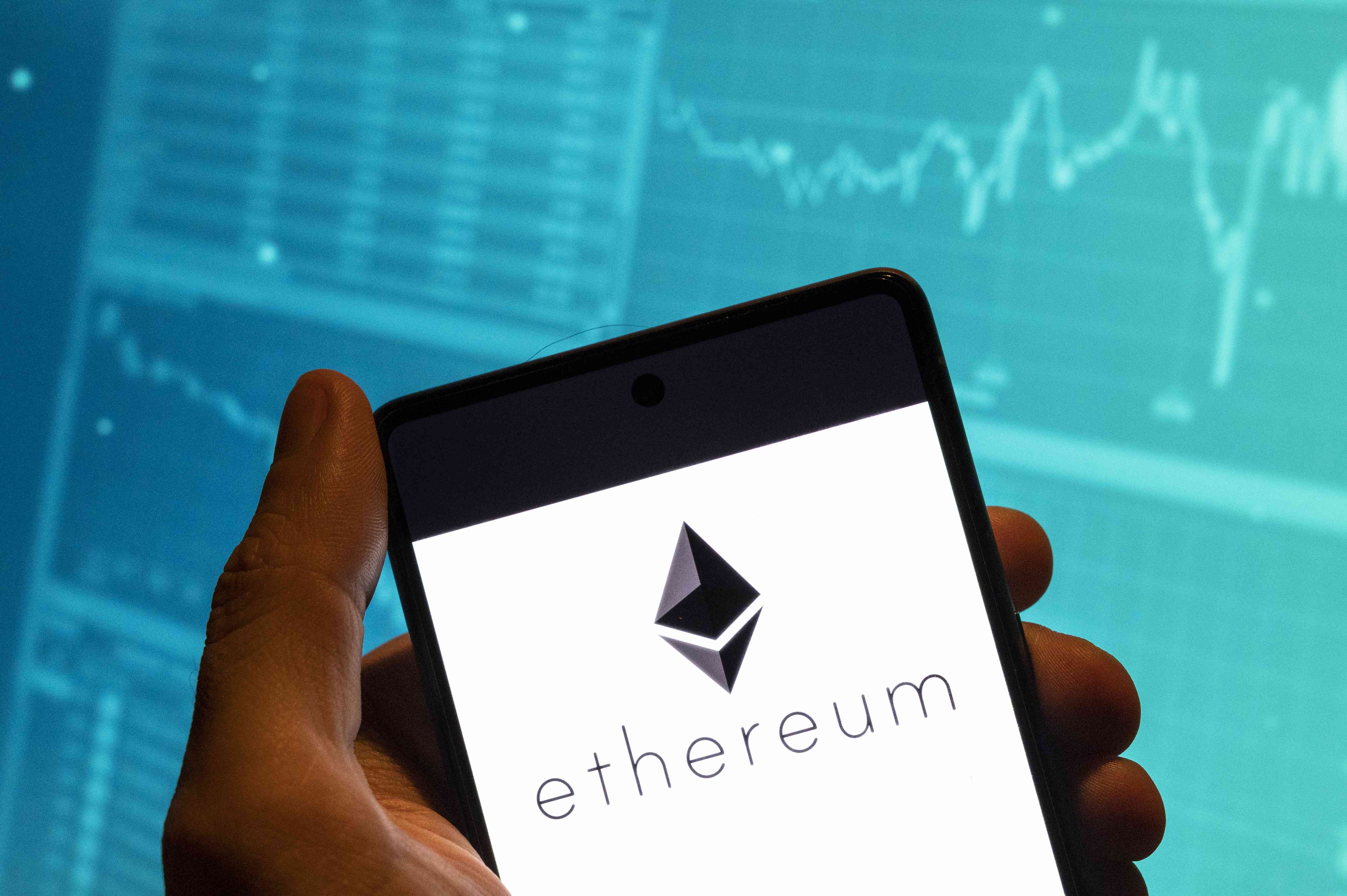 Ethereum displayed on a mobile phone in someone's hand. 