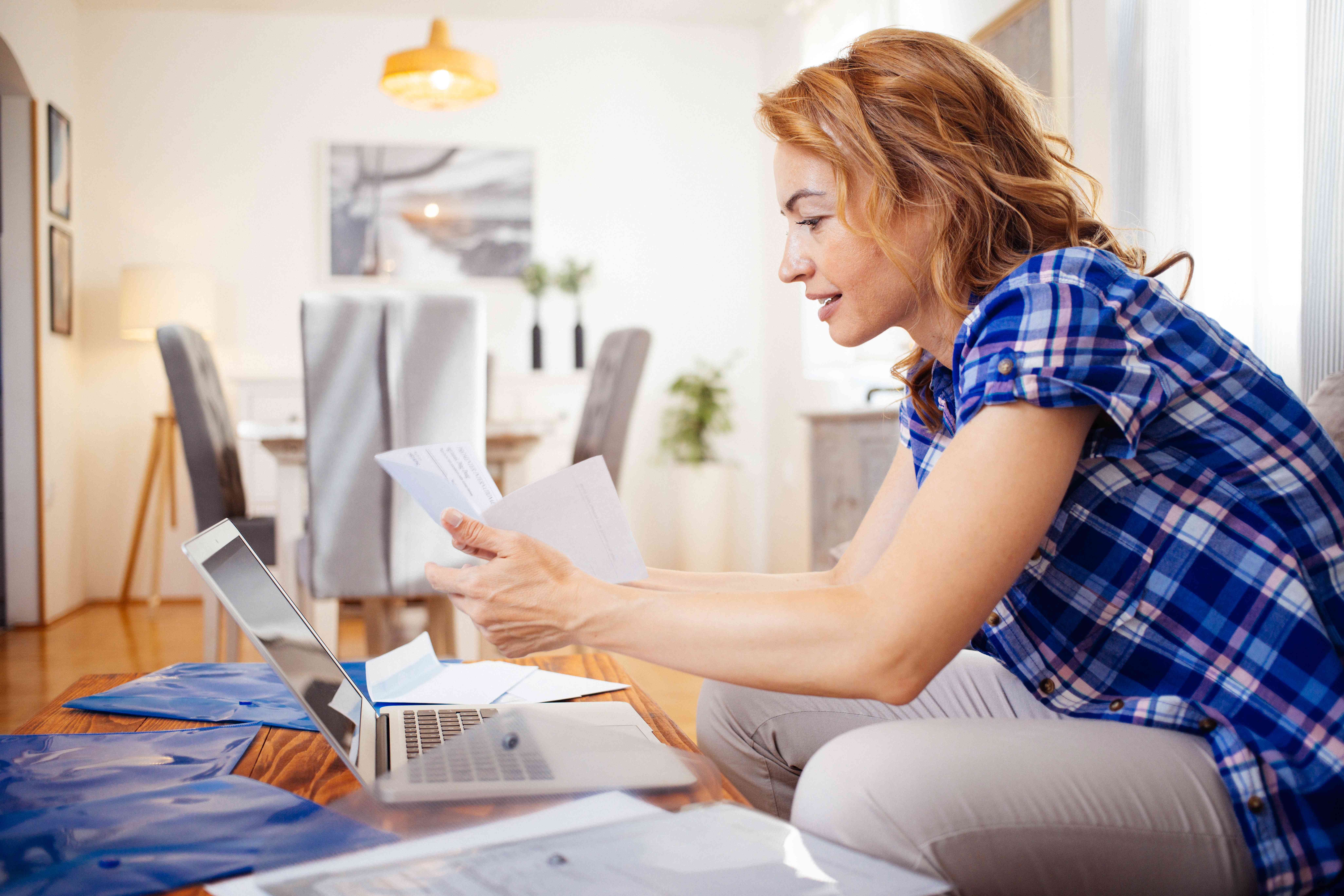 Woman looking over personal loan documents